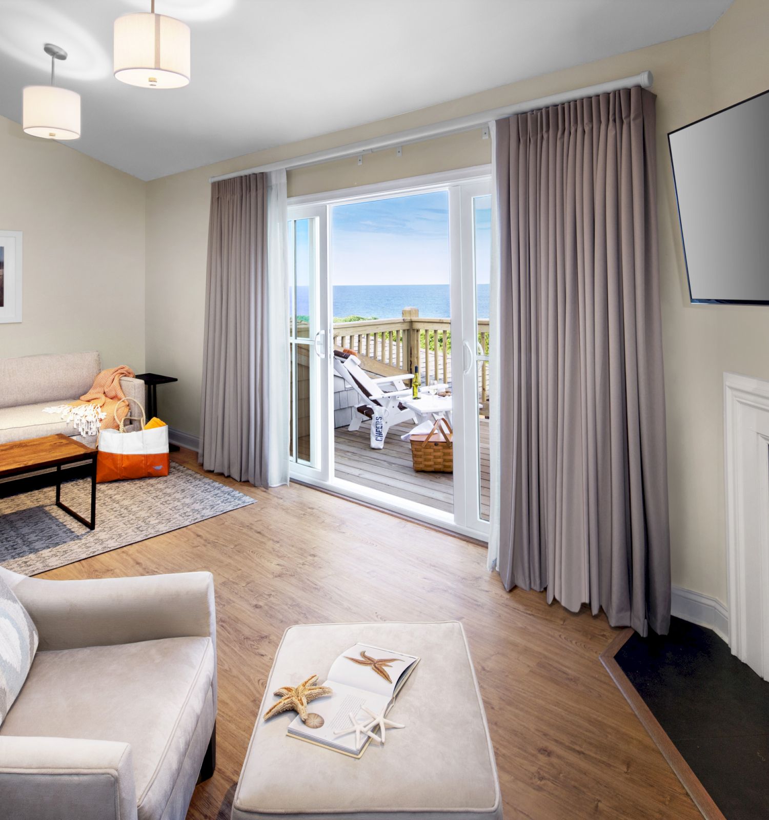 Sanderling Resort's cozy guest hotel presidential suite with a fireplace, living area and tv.
